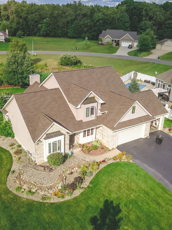 aerial view residential property with asphalt shingles roof installed lansing mi